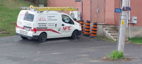 A North Frontenac Telephone Company service vehicle sits outside the switching station in Sharbot Lake.